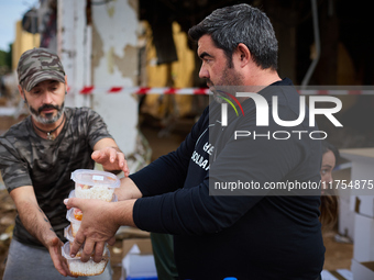 Volunteers deliver food in Benetusser, Spain, on november 08, 2024, due to the flood (