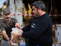 Volunteers deliver food in Benetusser, Spain, on november 08, 2024, due to the flood (