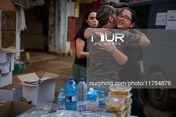 Volunteers deliver food in Benetusser, Spain, on november 08, 2024, due to the flood 