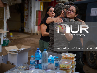 Volunteers deliver food in Benetusser, Spain, on november 08, 2024, due to the flood (