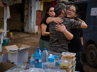 Volunteers deliver food in Benetusser, Spain, on november 08, 2024, due to the flood (