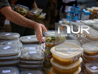 Volunteers deliver food in Benetusser, Spain, on november 08, 2024, due to the flood (