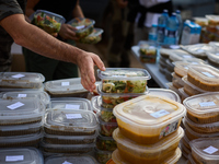 Volunteers deliver food in Benetusser, Spain, on november 08, 2024, due to the flood (