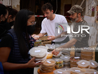 Volunteers deliver food in Benetusser, Spain, on november 08, 2024, due to the flood (