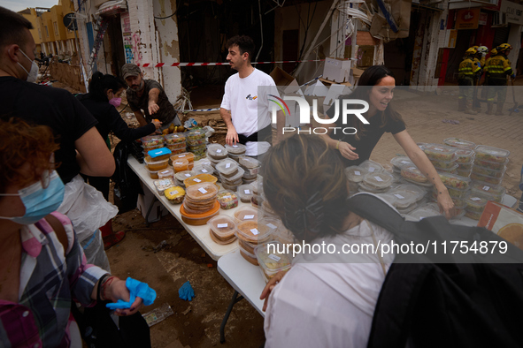 Volunteers deliver food in Benetusser, Spain, on november 08, 2024, due to the flood 