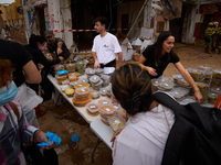 Volunteers deliver food in Benetusser, Spain, on november 08, 2024, due to the flood (