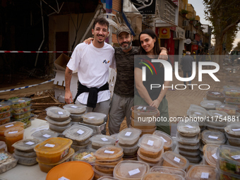 Volunteers deliver food in Benetusser, Spain, on november 08, 2024, due to the flood (