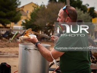 Volunteers deliver food in Benetusser, Spain, on november 08, 2024, due to the flood (