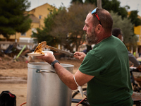 Volunteers deliver food in Benetusser, Spain, on november 08, 2024, due to the flood (