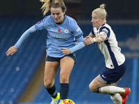 Lauren Hemp #11 of Manchester City W.F.C. is tackled by the opponent during the Barclays FA Women's Super League match between Manchester Ci...