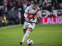 Andrei Ratiu of Rayo Vallecano is in action with the ball during the La Liga EA Sports 2024/25 football match between Rayo Vallecano and UD...