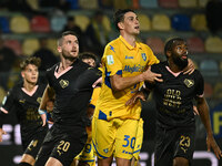 Thomas Henry of Palermo F.C., Ilario Monterisi of Frosinone Calcio, and Salim Diakite of Palermo F.C. participate during the 13th day of the...