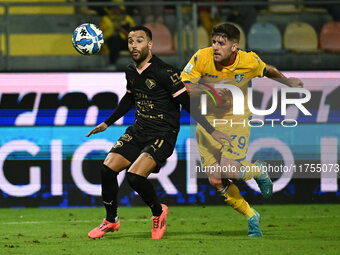 Roberto Insigne of Palermo F.C. and Gabriele Bracaglia of Frosinone Calcio are in action during the 13th day of the Serie BKT Championship b...