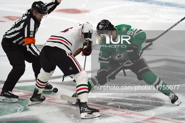 Wyatt Johnston #53 of the Dallas Stars faces off against Jason Dickinson #16 of the Chicago Blackhawks during the NHL match at American Airl...