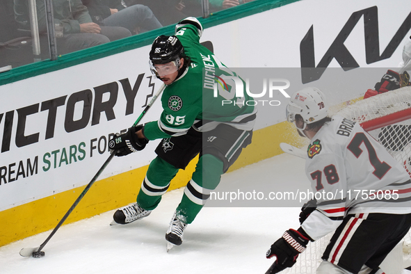 Matt Duchene #95 of the Dallas Stars skates on the ice while controlling the puck during the NHL match against the Chicago Blackhawks at Ame...