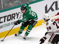 Matt Duchene #95 of the Dallas Stars skates on the ice while controlling the puck during the NHL match against the Chicago Blackhawks at Ame...