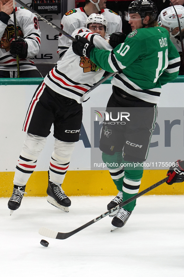 Wyatt Kaiser #44 of the Chicago Blackhawks hits Oskar Back #10 of the Dallas Stars during the NHL match at American Airlines Center in Dalla...