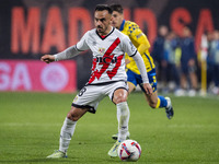 Alvaro Garcia of Rayo Vallecano is in action with the ball during the La Liga EA Sports 2024/25 football match between Rayo Vallecano and UD...