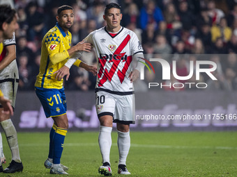 James Rodriguez of Rayo Vallecano (R) is in action against Benito Ramirez of UD Las Palmas (L) during the La Liga EA Sports 2024/25 football...