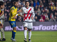 James Rodriguez of Rayo Vallecano (R) is in action against Benito Ramirez of UD Las Palmas (L) during the La Liga EA Sports 2024/25 football...