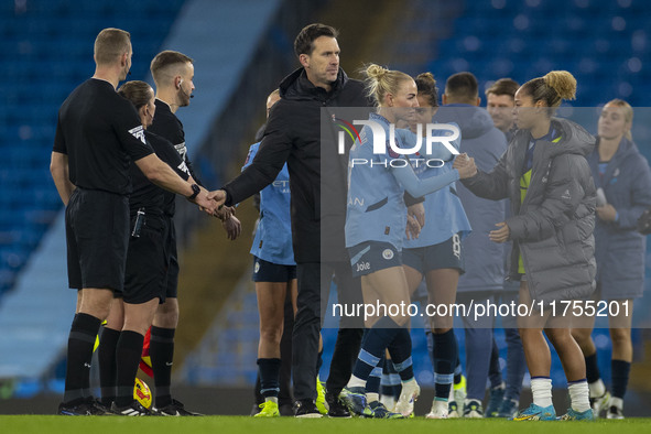 Manchester City W.F.C. manager Gareth Taylor shakes hands with officials at full time during the Barclays FA Women's Super League match betw...