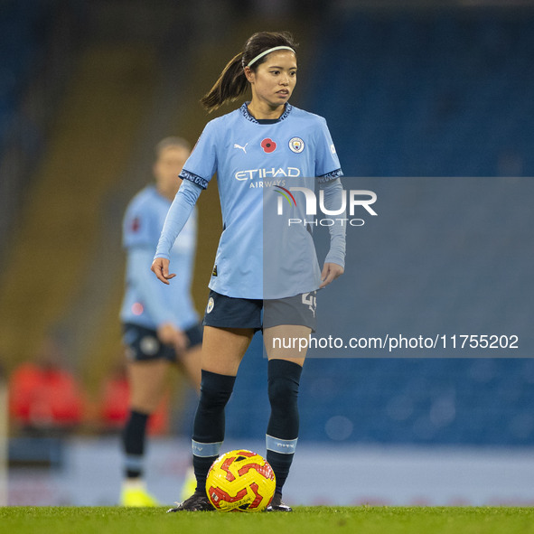 Yui Hasegawa, number 25 of Manchester City W.F.C., is in action during the Barclays FA Women's Super League match between Manchester City an...