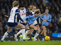 Lauren Hemp #11 of Manchester City W.F.C. is tackled by the opponents during the Barclays FA Women's Super League match between Manchester C...