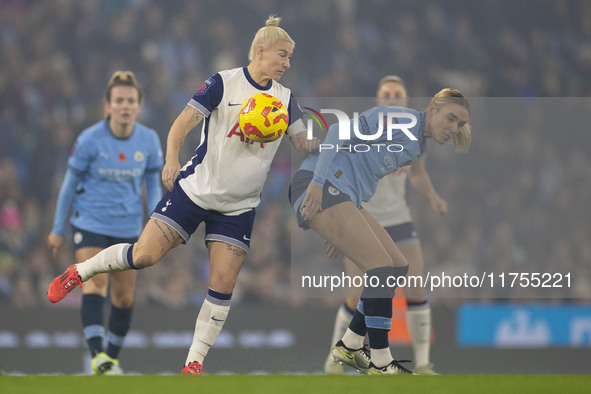 Jill Roord #10 of Manchester City W.F.C. challenges an opponent during the Barclays FA Women's Super League match between Manchester City an...