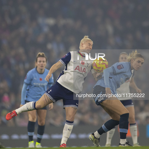 Jill Roord #10 of Manchester City W.F.C. challenges an opponent during the Barclays FA Women's Super League match between Manchester City an...