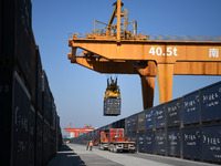 A gantry crane lifts containers at the Nanchang International Dry Port in Nanchang, Jiangsu province, China, on November 7, 2024. (