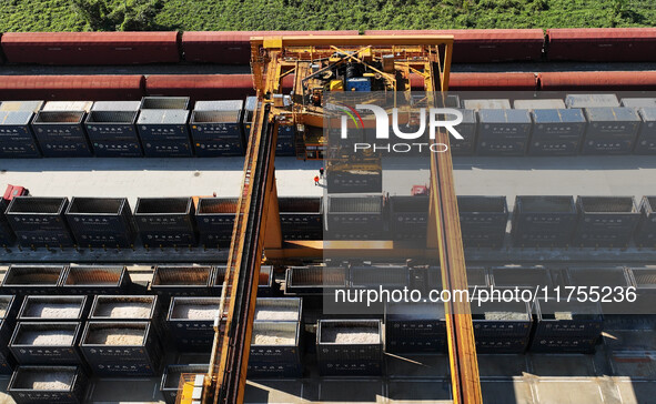 A gantry crane lifts containers at the Nanchang International Dry Port in Nanchang, Jiangsu province, China, on November 7, 2024. 