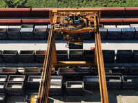 A gantry crane lifts containers at the Nanchang International Dry Port in Nanchang, Jiangsu province, China, on November 7, 2024. (