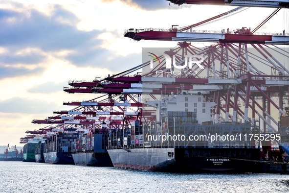 A large container ship conducts container operations at a berth at the Qianwan Container Terminal of Qingdao Port in Qingdao, China, on Nove...