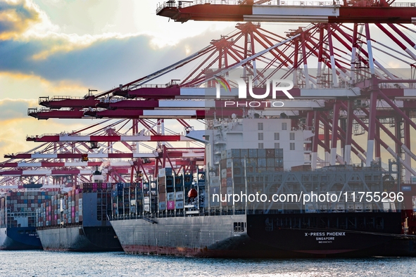 A large container ship conducts container operations at a berth at the Qianwan Container Terminal of Qingdao Port in Qingdao, China, on Nove...