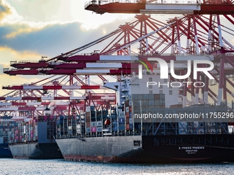 A large container ship conducts container operations at a berth at the Qianwan Container Terminal of Qingdao Port in Qingdao, China, on Nove...