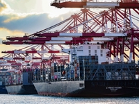 A large container ship conducts container operations at a berth at the Qianwan Container Terminal of Qingdao Port in Qingdao, China, on Nove...