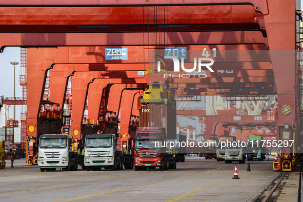 Container operations take place at the Qianwan Container terminal of Qingdao Port in Qingdao, China, on November 8, 2024. 