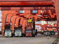 Container operations take place at the Qianwan Container terminal of Qingdao Port in Qingdao, China, on November 8, 2024. (