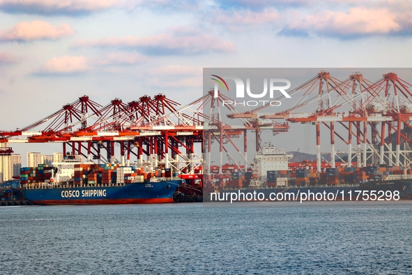 A large container ship conducts container operations at a berth at the Qianwan Container Terminal of Qingdao Port in Qingdao, China, on Nove...