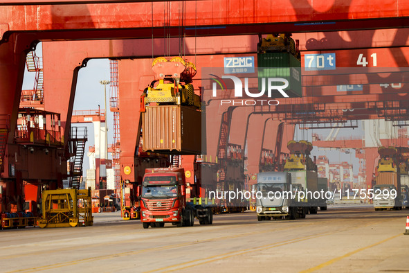 Container operations take place at the Qianwan Container terminal of Qingdao Port in Qingdao, China, on November 8, 2024. 