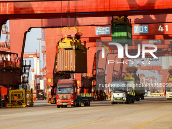 Container operations take place at the Qianwan Container terminal of Qingdao Port in Qingdao, China, on November 8, 2024. (