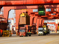 Container operations take place at the Qianwan Container terminal of Qingdao Port in Qingdao, China, on November 8, 2024. (