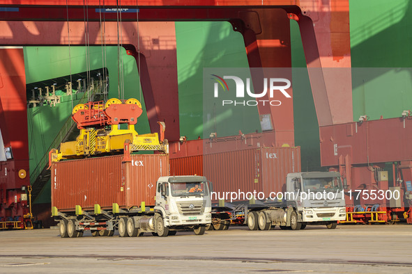 Container operations take place at the Qianwan Container terminal of Qingdao Port in Qingdao, China, on November 8, 2024. 