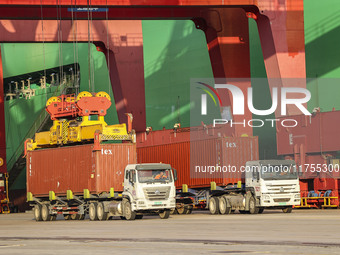 Container operations take place at the Qianwan Container terminal of Qingdao Port in Qingdao, China, on November 8, 2024. (