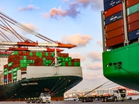 A large container ship conducts container operations at a berth at the Qianwan Container Terminal of Qingdao Port in Qingdao, China, on Nove...