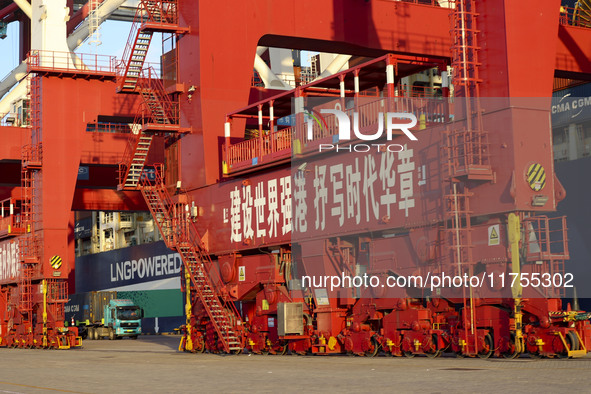 Container operations take place at the Qianwan Container terminal of Qingdao Port in Qingdao, China, on November 8, 2024. 