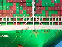 A global super-class container ship unloads containers at the Qianwan container terminal of Qingdao Port in Qingdao, China, on November 8, 2...