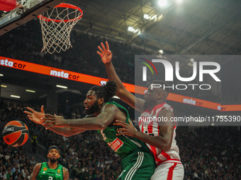 Mathias Lessort and Moustapha Fall are in an action moment during the Euroleague game between Panathinaikos and Olympiacos, with a final sco...