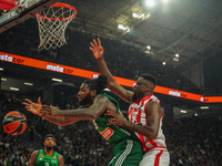 Mathias Lessort and Moustapha Fall are in an action moment during the Euroleague game between Panathinaikos and Olympiacos, with a final sco...