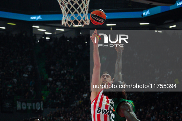 Nikola Milutinov and Mathias Lessort are in action during the Euroleague game between Panathinaikos and Olympiacos, with a final score of 89...